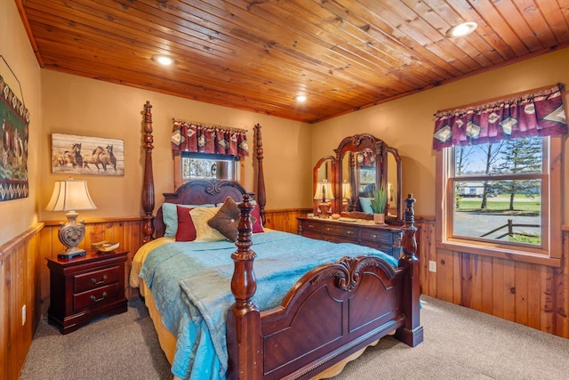 510 State Rd Unit 35, Centuria, WI 54024 - carpeted bedroom with recessed lighting, wood walls, wainscoting, and wood ceiling
