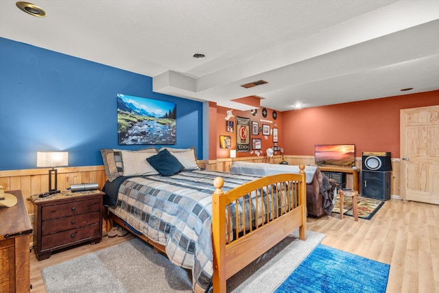 510 State Rd Unit 35, Centuria, WI 54024 - bedroom with a wainscoted wall, wood finished floors, and visible vents