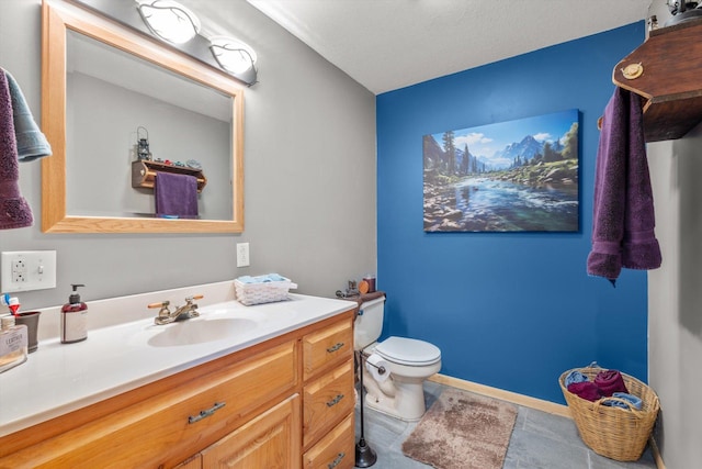 510 State Rd Unit 35, Centuria, WI 54024 - bathroom featuring vanity, baseboards, and toilet