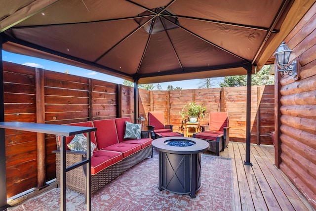 510 State Rd Unit 35, Centuria, WI 54024 - wooden terrace with a gazebo, an outdoor living space with a fire pit, and fence