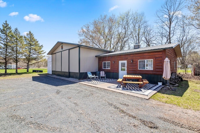 510 State Rd Unit 35, Centuria, WI 54024 - rear view of property with a chimney