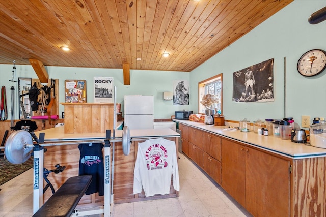 510 State Rd Unit 35, Centuria, WI 54024 - kitchen featuring freestanding refrigerator, black microwave, recessed lighting, light countertops, and wood ceiling