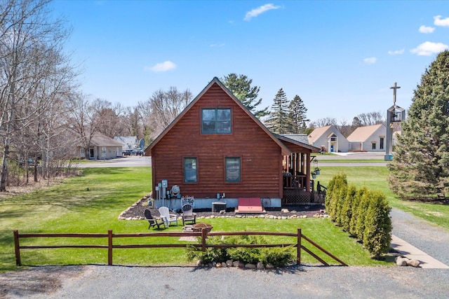 510 State Rd Unit 35, Centuria, WI 54024 - back of house featuring a lawn, fence, and central AC