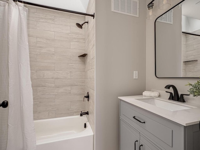 full bathroom featuring vanity, visible vents, and shower / tub combo with curtain