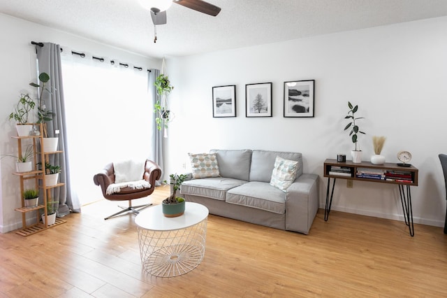2225 Ranchview Ln N Unit 9, Plymouth, MN 55447 - living room featuring ceiling fan and light wood-style floors