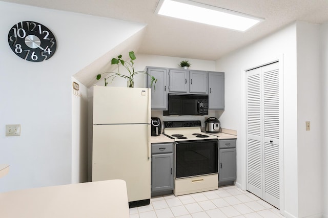 2225 Ranchview Ln N Unit 9, Plymouth, MN 55447 - kitchen with white appliances, gray cabinets, light countertops, and light tile patterned floors