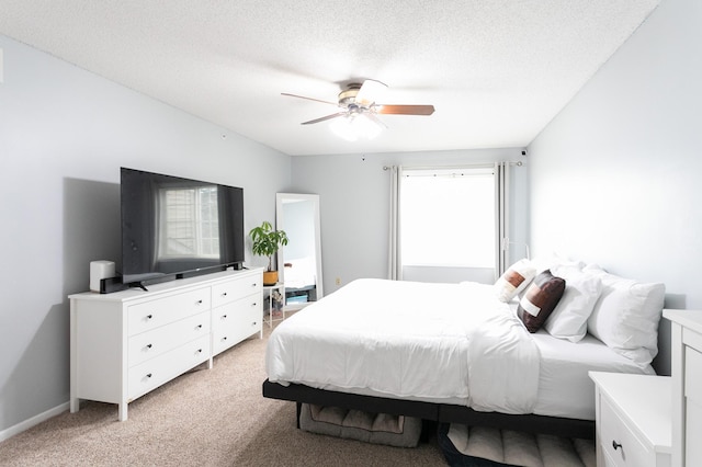 2225 Ranchview Ln N Unit 9, Plymouth, MN 55447 - bedroom featuring light carpet, a textured ceiling, and ceiling fan