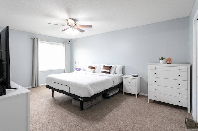 2225 Ranchview Ln N Unit 9, Plymouth, MN 55447 - bedroom featuring light colored carpet, ceiling fan, and a textured ceiling