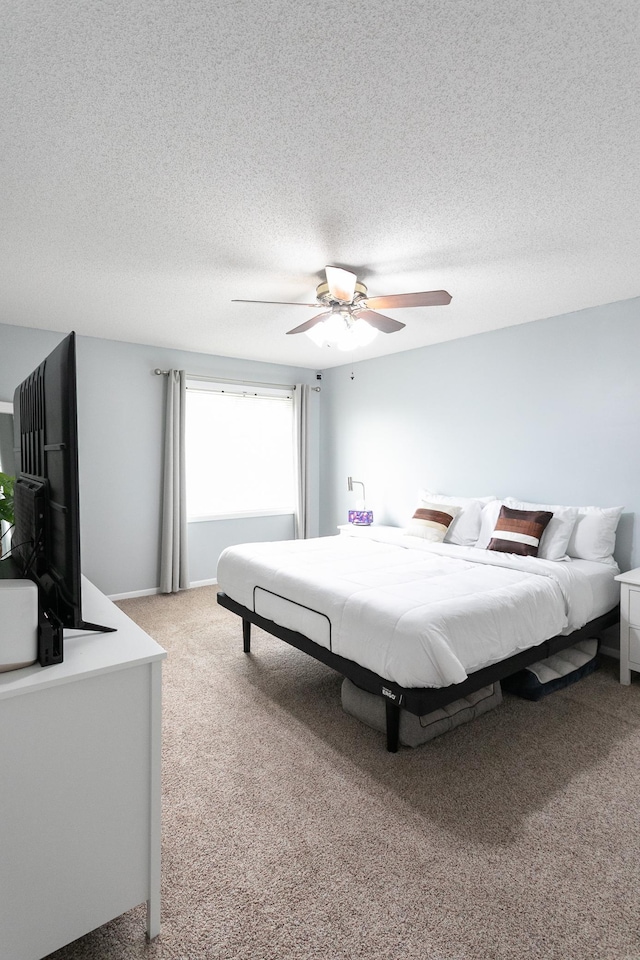 2225 Ranchview Ln N Unit 9, Plymouth, MN 55447 - bedroom featuring light colored carpet, a textured ceiling, and a ceiling fan
