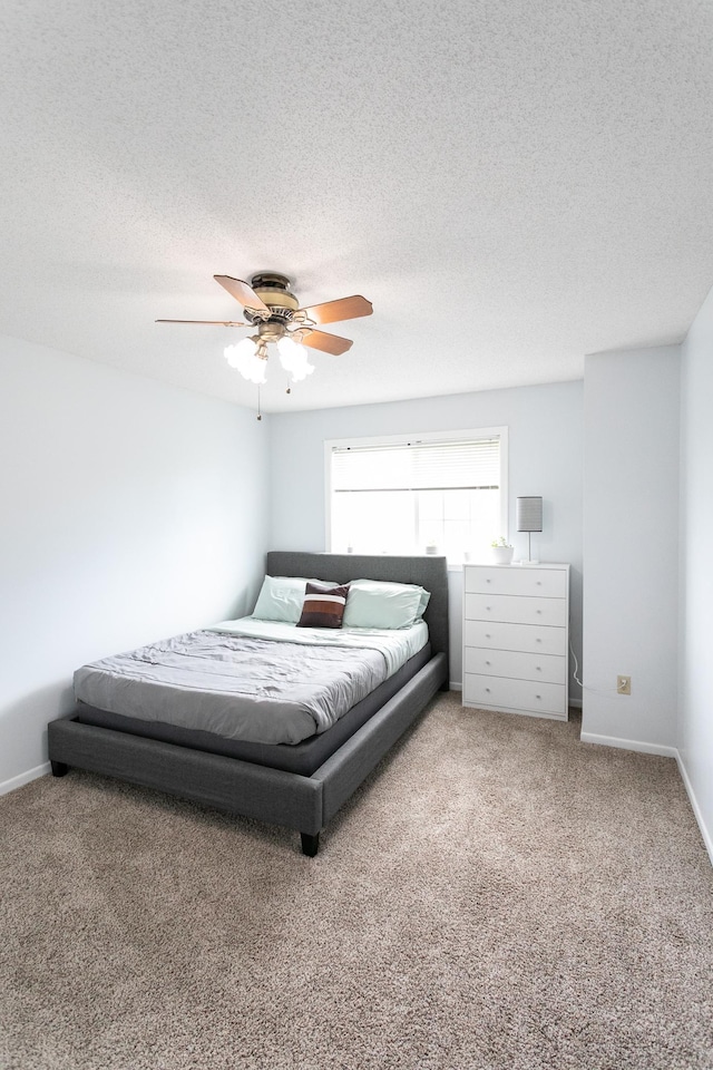 2225 Ranchview Ln N Unit 9, Plymouth, MN 55447 - bedroom featuring light colored carpet, ceiling fan, and a textured ceiling