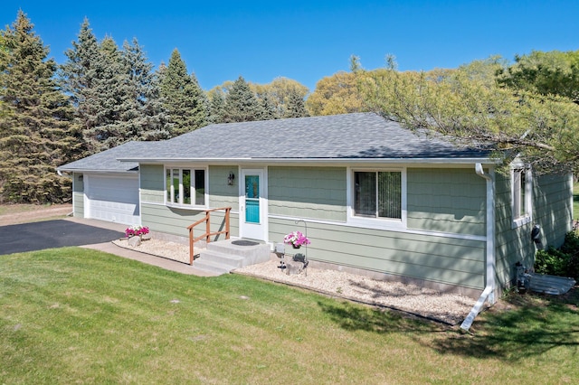 7830 Country Ln, Lino Lakes, MN 55014 - ranch-style home with a shingled roof, a front yard, an attached garage, driveway, and central AC