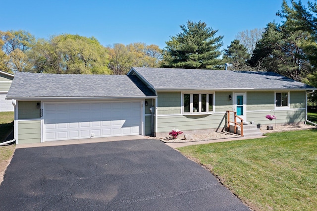 7830 Country Ln, Lino Lakes, MN 55014 - ranch-style home with a front lawn, a shingled roof, driveway, and an attached garage