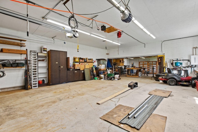 7830 Country Ln, Lino Lakes, MN 55014 - garage with a workshop area and a garage door opener