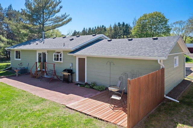 7830 Country Ln, Lino Lakes, MN 55014 - rear view of house with roof with shingles, a patio area, a yard, and cooling unit