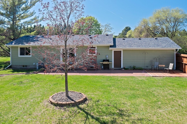 7830 Country Ln, Lino Lakes, MN 55014 - back of property featuring a lawn, roof with shingles, and a patio area