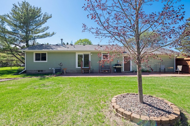 7830 Country Ln, Lino Lakes, MN 55014 - back of house featuring a patio, a yard, and central air condition unit