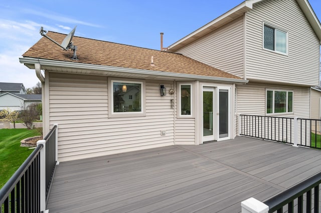 wooden deck with a lawn