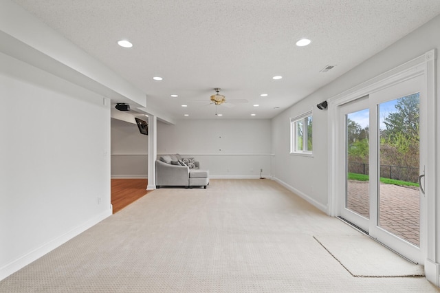unfurnished room featuring light carpet, baseboards, ceiling fan, and recessed lighting