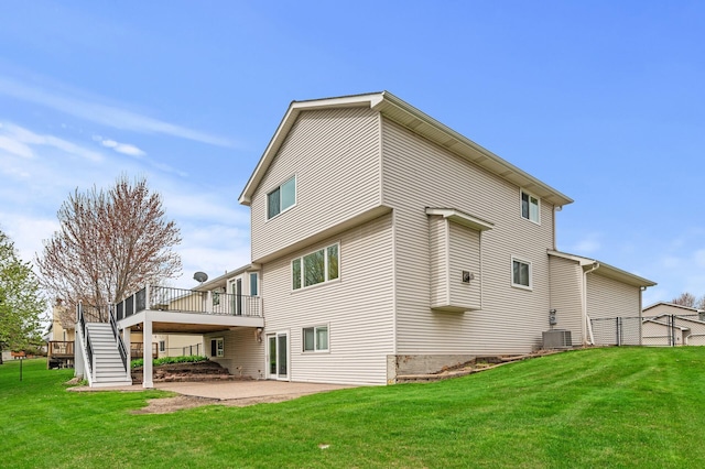 back of property with fence, stairs, a yard, a patio, and a wooden deck