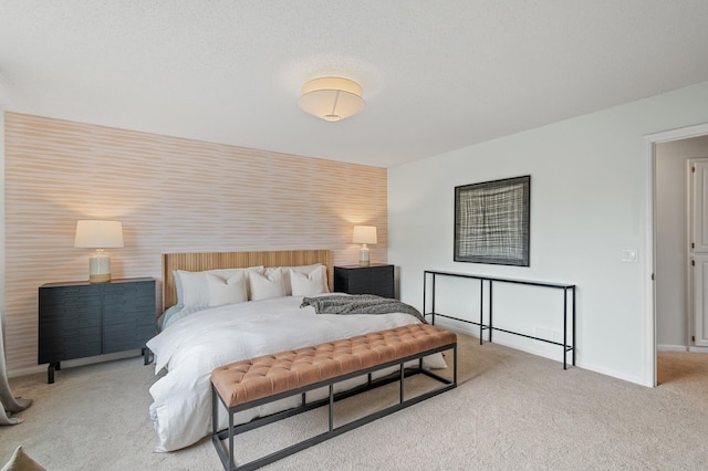 carpeted bedroom featuring baseboards