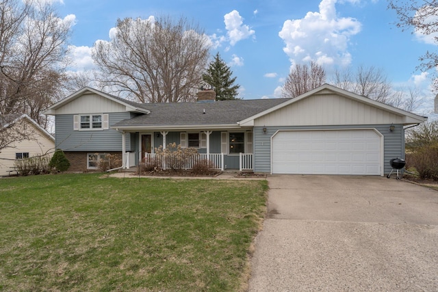 829 Church St, Saint Peter, MN 56082 - split level home with covered porch, an attached garage, a chimney, driveway, and a front lawn