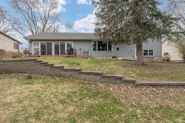 829 Church St, Saint Peter, MN 56082 - rear view of property featuring a sunroom and a lawn