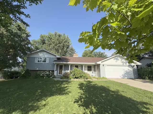 829 Church St, Saint Peter, MN 56082 - tri-level home featuring a garage, a chimney, a front yard, concrete driveway, and brick siding