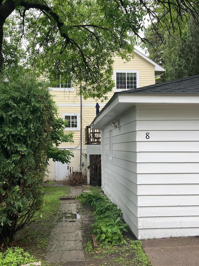 8 Queen Ave S, Minneapolis, MN 55405 - view of side of home with roof with shingles