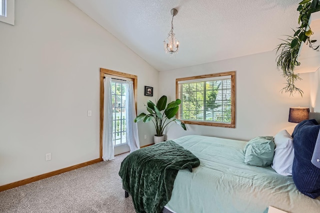 8 Queen Ave S, Minneapolis, MN 55405 - carpeted bedroom with access to outside, baseboards, vaulted ceiling, a chandelier, and a textured ceiling