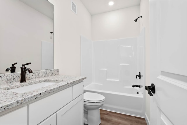10203 Twin Lakes Pkwy NW, Elk River, MN 55330 - bathroom featuring wood finished floors, vanity, bathtub / shower combination, and recessed lighting