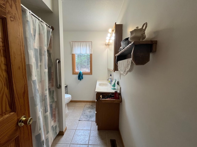 14879 Benson Rd, Grantsburg, WI 54840 - full bath with tile patterned flooring, vanity, baseboards, toilet, and a shower with shower curtain