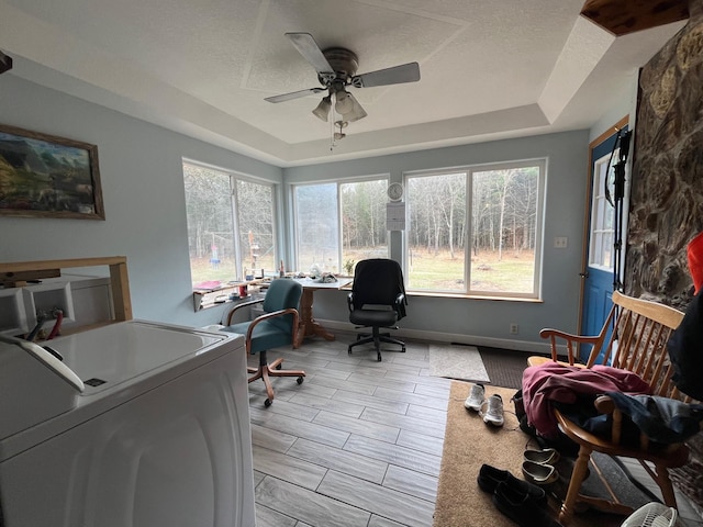 14879 Benson Rd, Grantsburg, WI 54840 - office space featuring a ceiling fan, washer / dryer, a textured ceiling, and a tray ceiling
