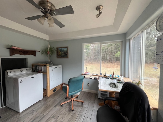14879 Benson Rd, Grantsburg, WI 54840 - interior space with laundry area, ceiling fan, wood finish floors, baseboards, and washer and clothes dryer