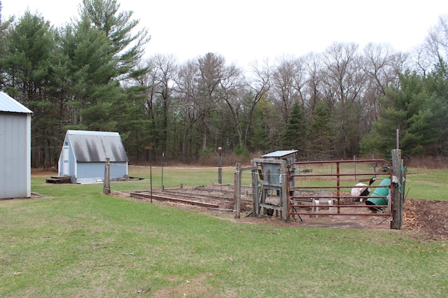 14879 Benson Rd, Grantsburg, WI 54840 - view of yard with a view of trees, a shed, and an outbuilding