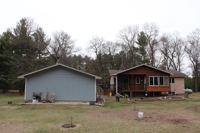14879 Benson Rd, Grantsburg, WI 54840 - rear view of house with a yard and a porch
