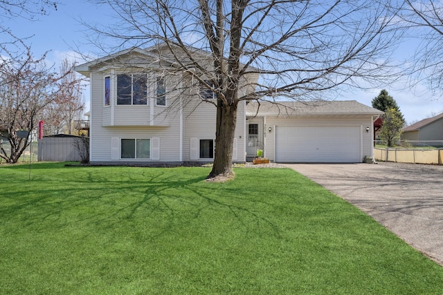 30763 Reflection Ave, Shafer, MN 55074 - tri-level home with a garage, a front lawn, fence, and concrete driveway