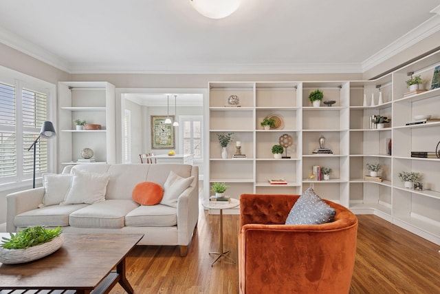 2615 Park Ave Unit 214, Minneapolis, MN 55407 - living area featuring ornamental molding, built in features, and wood finished floors