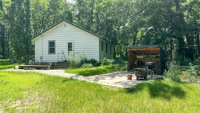 back of house with a yard