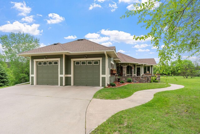 374 Indigo Trl, Troy Twp, WI 54022 - view of front of home with a garage, a front yard, concrete driveway, and a porch