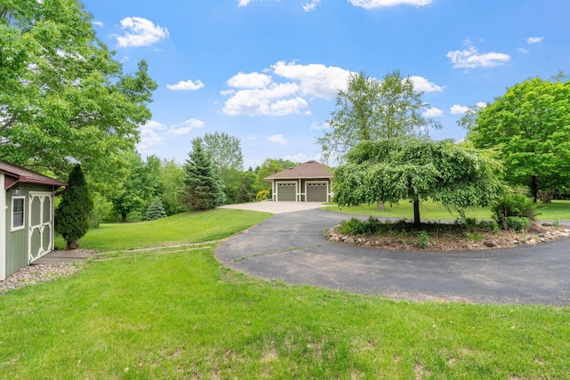 374 Indigo Trl, Troy Twp, WI 54022 - view of front of home featuring a front lawn and a detached garage