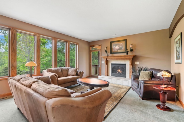 374 Indigo Trl, Troy Twp, WI 54022 - carpeted living area with a tiled fireplace and baseboards