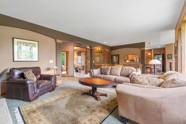 374 Indigo Trl, Troy Twp, WI 54022 - carpeted living room featuring ornate columns and arched walkways