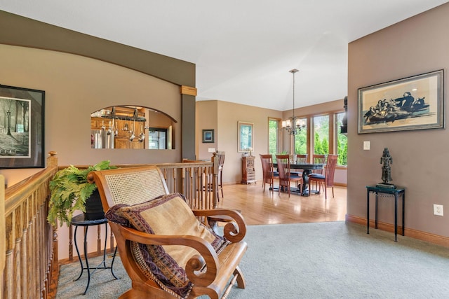 374 Indigo Trl, Troy Twp, WI 54022 - living area with a chandelier, carpet, baseboards, and vaulted ceiling