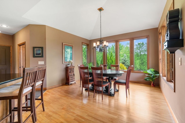 374 Indigo Trl, Troy Twp, WI 54022 - dining room featuring baseboards, light wood-style flooring, a chandelier, vaulted ceiling, and recessed lighting