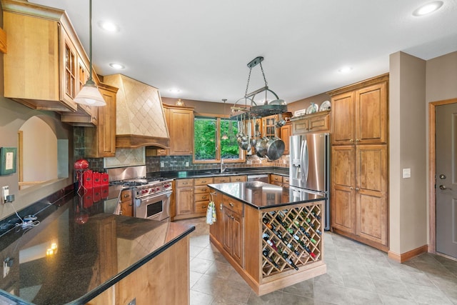 374 Indigo Trl, Troy Twp, WI 54022 - kitchen with appliances with stainless steel finishes, custom range hood, decorative backsplash, a sink, and recessed lighting
