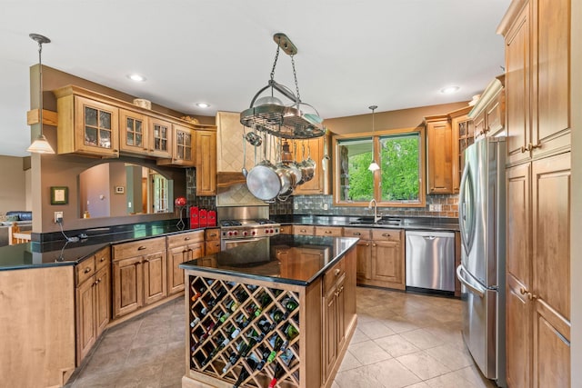 374 Indigo Trl, Troy Twp, WI 54022 - kitchen featuring appliances with stainless steel finishes, a sink, backsplash, glass insert cabinets, and a center island
