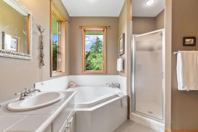 374 Indigo Trl, Troy Twp, WI 54022 - full bathroom featuring a stall shower, vanity, a bath, and tile patterned floors