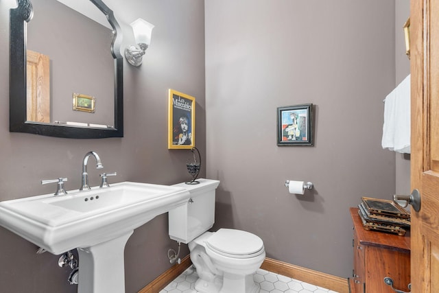 374 Indigo Trl, Troy Twp, WI 54022 - half bathroom with toilet, baseboards, and tile patterned floors