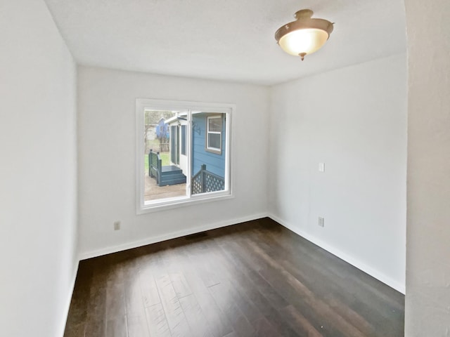 1005 Honeysuckle Ln, Farmington, MN 55024 - unfurnished room with baseboards and dark wood-type flooring