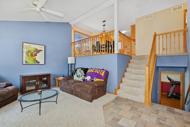 402 13th Ave NE, Buffalo, MN 55313 - carpeted living room featuring ceiling fan, lofted ceiling, and stairs
